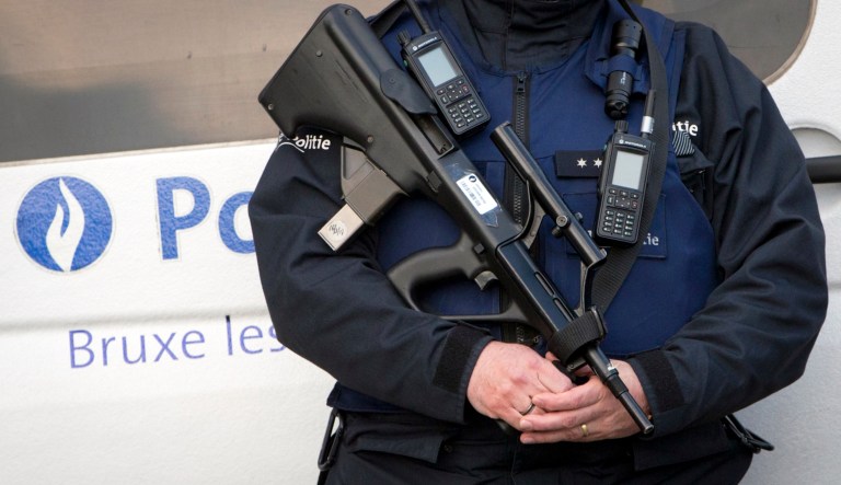 Police patrol outside the Brussels justice palace.