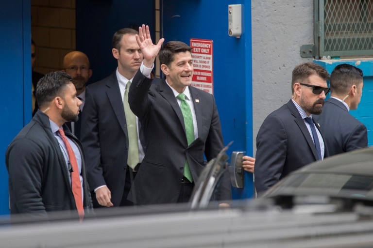 Ryan was greeted by the principal before stopping into a classroom and receiving a full tour of the academy, which shares space with a public school. (AP Photo/Mary Altaffer)