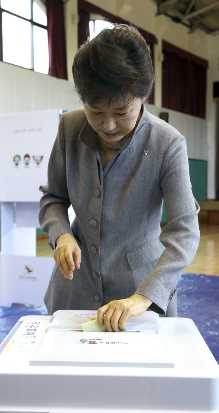 South Korean President Park Geun-hye casts her ballot for local elections at a polling station in Seoul, South Korea, Wednesday, June 4, 2014. South Koreans began voting Wednesday in local elections seen as a test of how the public feels about President Park Geun-hye's handling of April's deadly ferry sinking. (AP Photo/Yonhap, Do Kwang-hwan) KOREA OUT