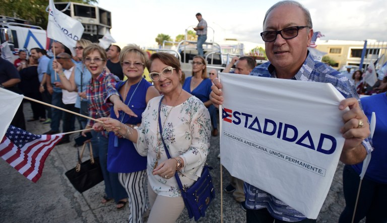 Puerto Rican Gov. Ricardo Rossello appointed three officials on Monday to the island's Democracy Commission, which is tasked with lobbying Congress to move on its statehood request. (AP Photo/Carlos Giusti)