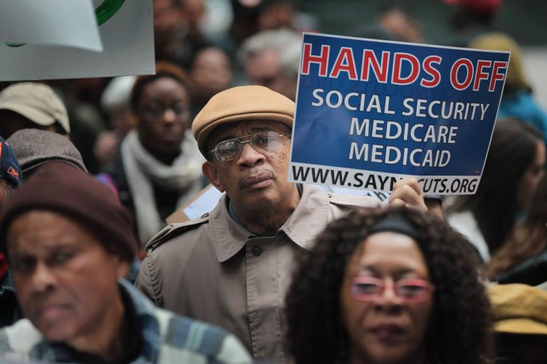 Demonstrators protest against cuts to Medicare, and Medicaid. (Scott Olson/Getty Images)