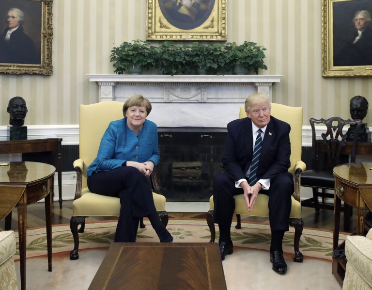 At one point Merkel reportedly asked Trump for a handshake. Trump seemed to ignore the request. (AP Photo/Evan Vucci)