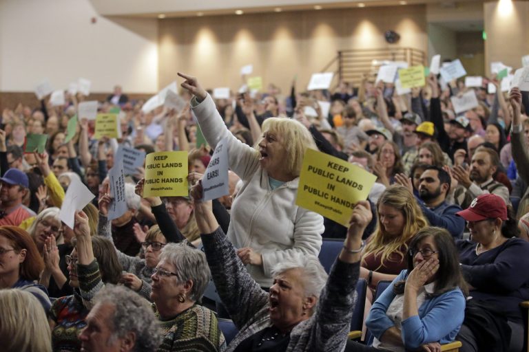Tami Sablan shouts as Rep. Jason Chaffetz speaks during a town hall meeting at Brighton High School, Thursday, Feb. 9, 2017, in Cottonwood Heights, Utah. Hundreds of people lined up early for a town hall with Chaffetz on Thursday evening, many holding signs criticizing the congressman's push to repeal the newly-named Bears Ears National Monument in southern Utah. (AP Photo/Rick Bowmer)
