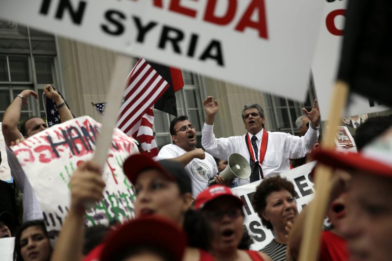 Members of the local Syrian community chant after marching in protest against the United States' involvement in Syria on Friday in Allentown, Pa. (AP/Matt Slocum)