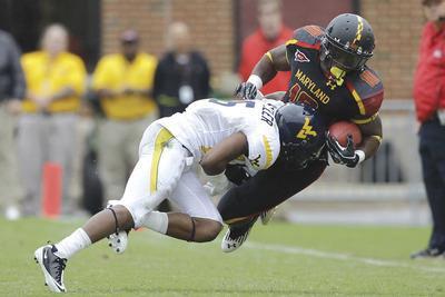 Rob Carr/Getty Images
Pat Miller and West Virginia took a big lead, then held on despite a furious rally by D.J. Adams and Maryland on Saturday.