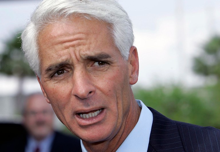   FILE - In this April 5, 2007 file photo, Florida Gov. Charlie Crist talks to the media at the Miami airport, about the plan to restore voting and other civil rights to felons who have finished their sentences. Former Florida Gov. Charlie Crist has announced on Twitter that he's joining the Democratic Party, Friday, Dec. 7, 2012. (AP Photo/Alan Diaz, File)  