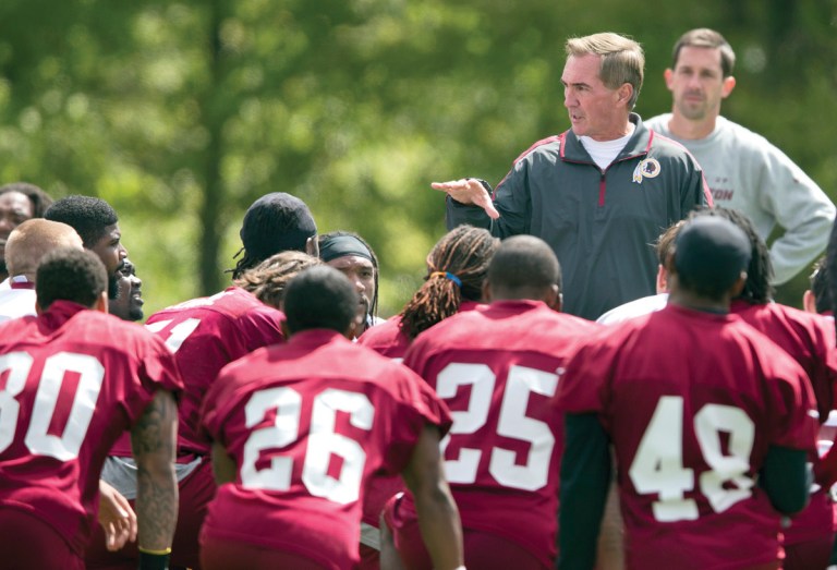 Evan Vucci/AP
Redskins coach Mike Shanahan talks to players during a rookie minicamp practice session at Redskins Park on Sunday.