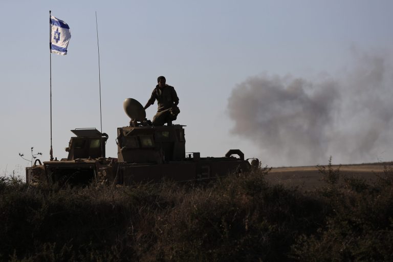 An Israeli solder looks on the site near the Israeli Gaza border, where a man was injured from a mortar shell fired from the Gaza Strip, Sunday, Aug. 3, 2014. (AP Photo/Tsafrir Abayov)
