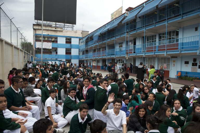 Students gather in the courtyard of their school after an earthquake shook Mexico City, Thursday, May 8, 2014. A strong earthquake in southern Guerrero state shook the southern Pacific coast of Mexico and several states, including the capital. (AP Photo/Rebecca Blackwell)