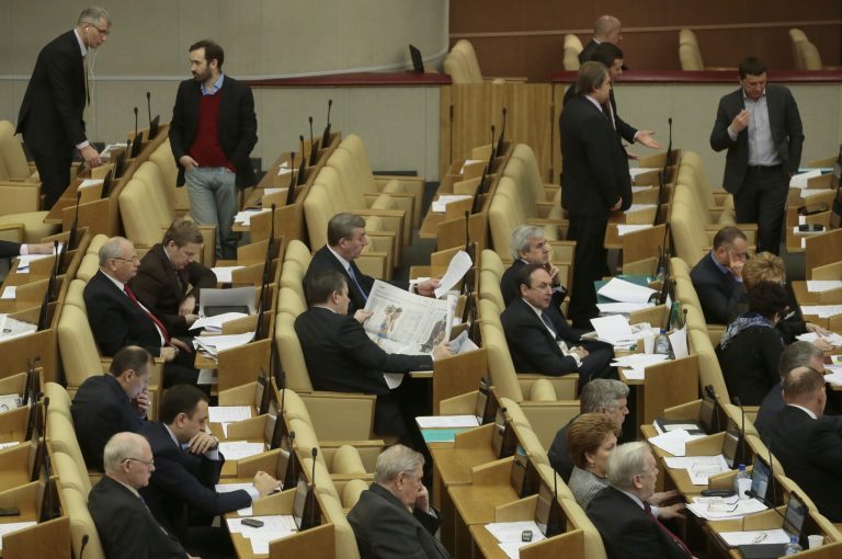   Russian lawmakers attend a session of the lower house of the State Duma in Moscow, Russia, Friday, Dec. 21, 2012. The lower house of parliament takes a final vote on the measure Friday against the United States that would include banning adoption of Russian children by Americans. Some top government officials oppose it, but President Vladimir Putin hasn't tipped his hand on whether he'd sign it into law. (AP Photo/Mikhail Metzel)  