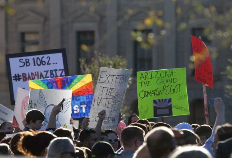 Opponents of the SB1062, a religious freedom bill, urged Gov. Brewer to veto the bill during a protest rally at the state Capitol on Feb. 21. (AP Photo/The Arizona Republic, Cheryl Evans)