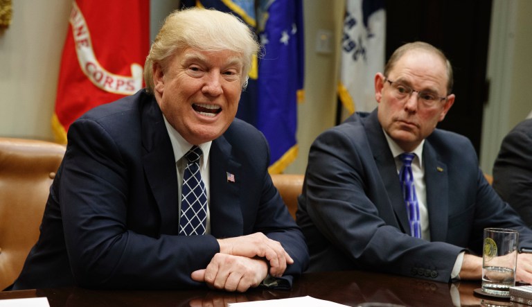 National Fraternal Order of Police President Chuck Canterbury listens at right as President Donald Trump speaks during a meeting with the Fraternal Order of Police, Tuesday, March 28, 2017, in the Roosevelt Room of the White House in Washington.