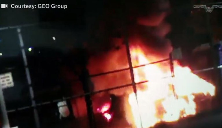 A fire is seen at an ICE detention center.