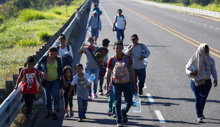 Honduras migrants, part of the caravan hoping to reach the U.S. border, walk on a road in Tapachula, Chiapas State, Mexico, Friday, Jan. 18,2019. Hundreds of Central American migrants are walking and hitchhiking through the region as part of a new caravan of migrants hoping to reach the United States.