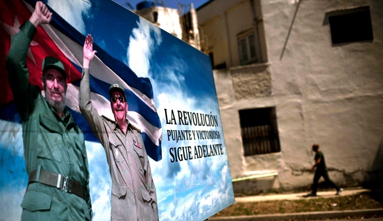 A poster of Fidel Castro and Cuba's President Raul Castro stands in Havana, Cuba, Wednesday, April 18, 2018. The Cuban government on Wednesday selected 57-year-old First Vice President Miguel Mario Diaz-Canel Bermudez as the sole candidate to succeed Raul Castro in a transition aimed at ensuring that the country's single-party system outlasts the aging revolutionaries who created it.