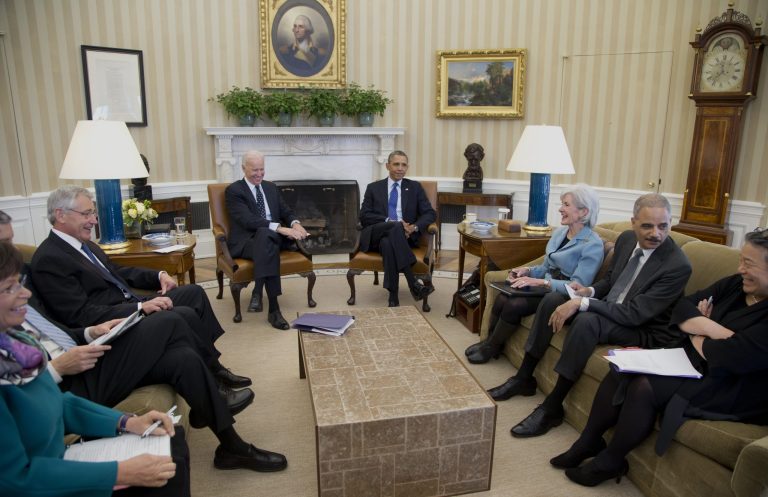 President Barack Obama and Vice President Joe Biden, center, meet with, from left, White House Senior Adviser Valerie Jarrett, Education Secretary Arne Duncan, Defense Secretary Chuck Hagel, Health and Human Services Secretary Kathleen Sebelius, Attorney General Eric Holder, and Executive Director of the White House Council on Women and Girls, Tina Tchen, who is also the Director of the White House Office of Public Engagement, in the Oval Office of the White House in Washington, Wednesday, Jan. 22, 2014, to discuss the Council on Women and Girls.  (AP Photo/Carolyn Kaster)