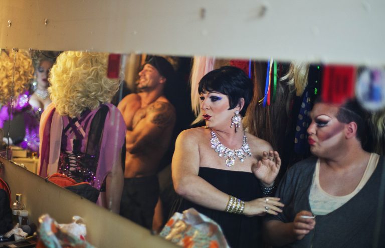 In this photo taken Saturday, Feb. 8, 2014, Andrei Sarkisian, second from right, who goes by the stage name of Miss Zhuzha, gets ready backstage before a performance at the Mayak cabaret, the most reputable gay club in Sochi, Russia, host to the 2014 Winter Olympics. Russia adopted a law last year, prohibiting vaguely defined propaganda of non-traditional sexual relations and pedophilia. The legislation makes it illegal to disseminate information to children even if it merely shows that gay people are just like everybody else. (AP Photo/David Goldman)
