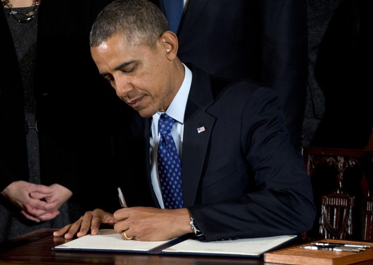 President Obama signs a memorandum creating a task force to respond to campus rapes during an event for the Council on Women and Girls in the East Room of the White House in Washington. The Obama administration is taking steps to help colleges and universities measure the magnitude of sexual assaults on their campuses and provide better protections for victims. (AP Photo/Carolyn Kaster, File)