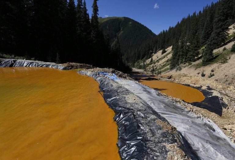 Water flows through a series of sediment retention ponds built to reduce heavy metal and chemical contaminants from the Gold King Mine wastewater accident outside Silverton, Colo. (AP Photo/Brennan Linsley, File)