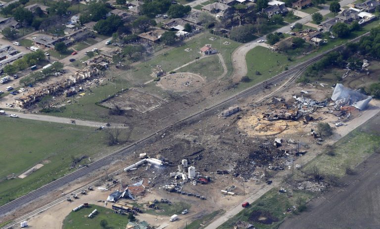 This April 18, 2013 file photo shows an aerial view of the remains of a fertilizer plant and an apartment complex to the left, destroyed by an explosion in West, Texas.  The government has failed to inspect virtually all of the chemical facilities that it considers to be at high risk for a terror attack, numbering in the thousands, and has underestimated the threat to densely populated cities, congressional investigators say.  (AP Photo/Tony Gutierrez, File)