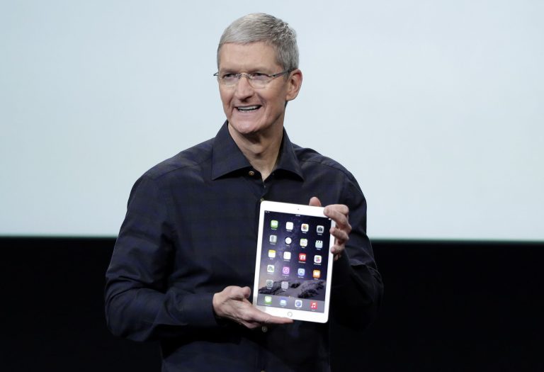 Apple CEO Tim Cook introduces the Apple iPad Air 2 during an event at Apple headquarters on Thursday, Oct. 16, 2014 in Cupertino, Calif. (AP Photo/Marcio Jose Sanchez)