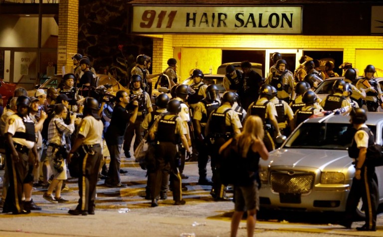 The filing —œmarks the beginning of ... the process of ensuring that [the citizens of Ferguson] receive the rights and protections guaranteed to every American under the law,—? Attorney General Loretta Lynch said in a statement. (AP Photo)