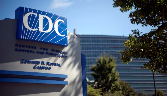 FILE - In this Tuesday, Oct. 8, 2013, file photo, a sign marks the entrance to the federal Centers for Disease Control and Prevention in Atlanta. The CDC said in a press release on May 19, 2016, that at least one violation was uncovered in nearly 80 percent of public pool and hot tub inspections in five states.