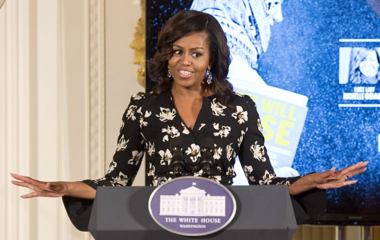 First lady tells girls to turn negative feedback into motivation on international girls day. (AP Photo/Molly Riley)