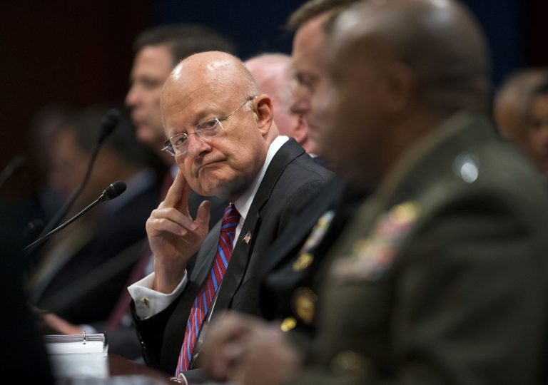 Director of National Intelligence James Clapper, center, listens on Capitol Hill in Washington, Thursday, Sept. 10, 2015, to testimony given by Director of the Defense Intelligence Agency, Lt. Gen. Vincent Stewart, far right, duirng the House Intelligence Committee hearing on cyber threats. (AP Photo/Pablo Martinez Monsivais)