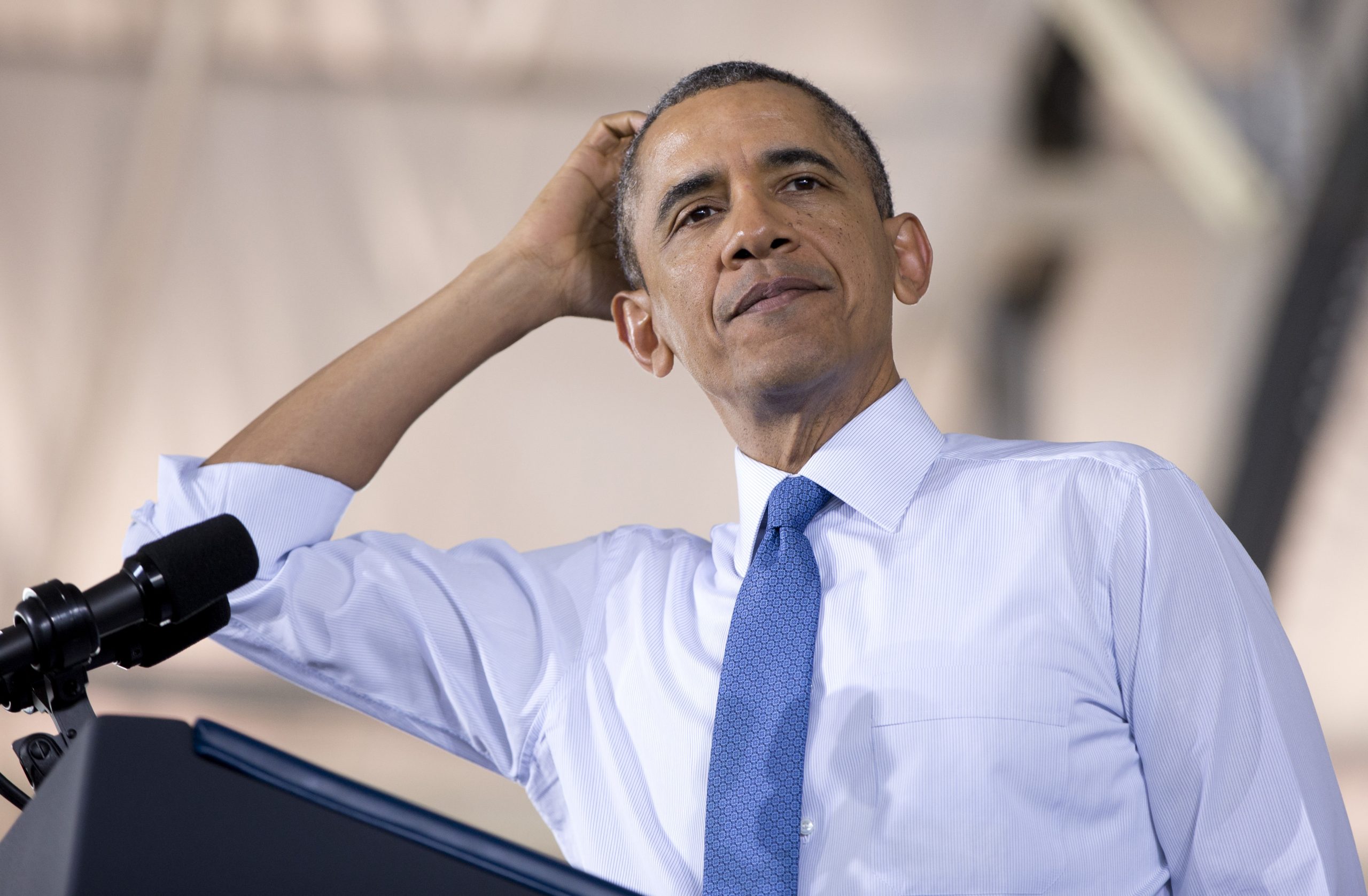 President Obama, tackled in the end zone, has no reason to celebrate