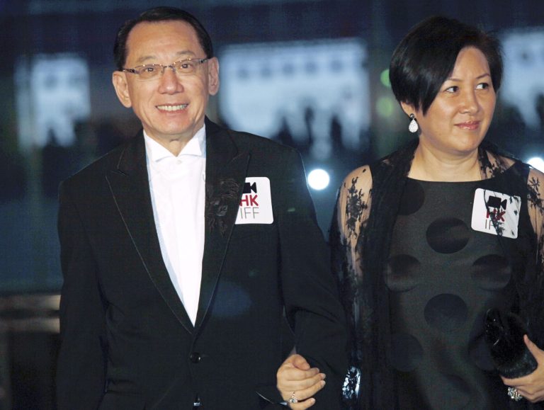 FILE - In this March 22, 2009 file photo, Albert Yeung, left, chairman of the Hong Kong media conglomerate Emperor Entertainment Group and his wife attend the premiere of his film 
