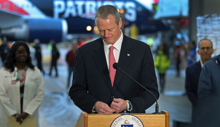 East Boston, MA: 04-01-20: A New England Patriots jet arrived at Logan Airport after flying from China with a massive shipment of over one million N95 masks which will be used in Boston and New York to help fight the spread of the coronavirus. Massachusetts governor Charles Baker got emotional and appeared on the verge of tears as he thanked the Kraft family at the start of his remarks. Patriots CEO Jonathan Kraft is in the backround at right. 