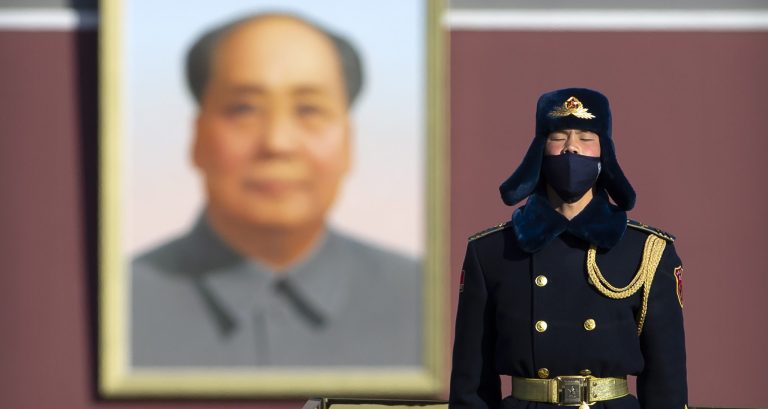Sun Shuopeng, Vice President of China's Red Cross, right, flanked by respiratory diseases expert from the Sichuan University, Zongan Liang, third from right, speaks to journalists outside the Spallanzani Hospital for Infectious Diseases in Rome, Saturday, March 14, 2020. For most people, the new coronavirus causes only mild or moderate symptoms. For some, it can cause more severe illness, especially in older adults and people with existing health problems. In the background doctors from the Spallanzani Hospital.