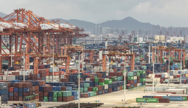 Containers and gantry cranes stand at Haitian Container Terminal, operated by the Xiamen Port Authority, in Xiamen, China, on Monday, Aug. 26, 2019. 