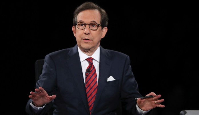 Moderator Chris Wallace of FOX News guides the discussion between Democratic presidential nominee Hillary Clinton and Republican presidential nominee Donald Trump during the third presidential debate at UNLV in Las Vegas, Wednesday, Oct. 19, 2016.