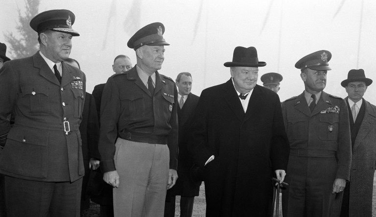 Winston Churchill on arrival at SHAPE headquarters in Paris for lunch on Dec. 18, 1951. There to greet him were, left to right: Air Chief Marshal Sir Hugh Saunders, General Dwight Eisenhower, General Alfred Gruenther. Air Marshal Saunders is air chief of staff to Gen. Eisenhower and Gen. Gruenther is the supreme commanderâs chief of staff.