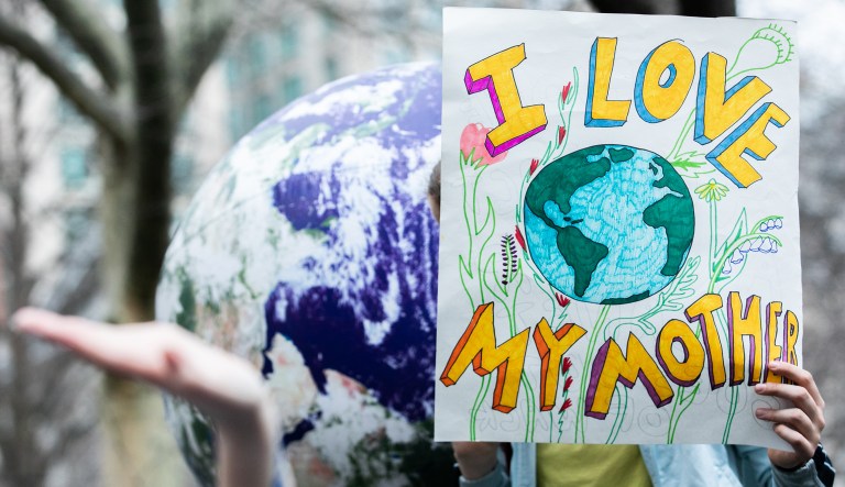 A demonstrator holds a sign reading "I Love My Mother" during the U.S. Youth Climate Strike in New York, U.S., on Friday, March 15, 2019.