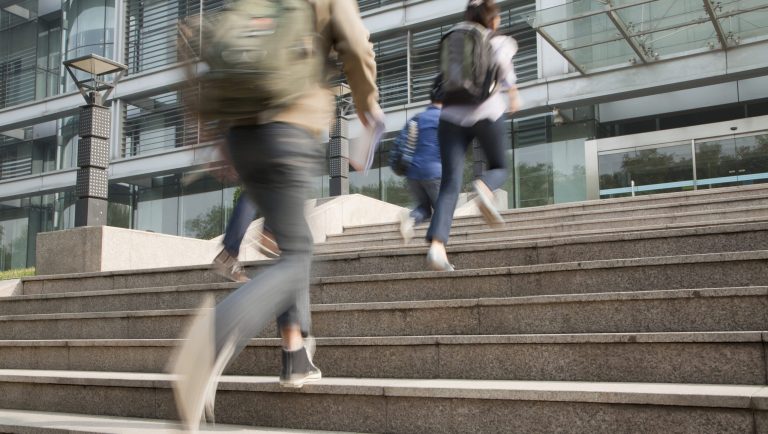 In this September 2017 photo, students walk to class on the University of Pennsylvania campus in Philadelphia. As academia becomes increasingly competitive in attracting top students and staff, universities are turning to retail to create study, work, and play environments that set themselves apart.