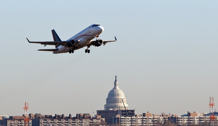 A Republic Airways jet takes off from Reagan National Airport in Washington, Thursday, Feb. 23, 2012. The Capitol is seen across the Potomac River.