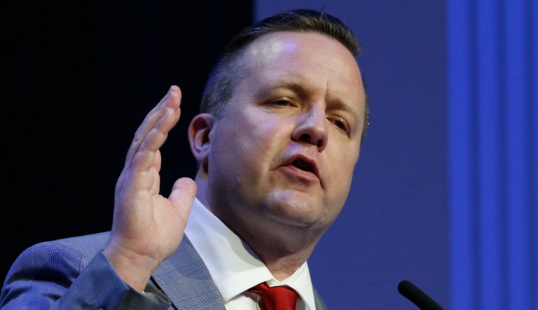 Republican primary senatorial candidate Corey Stewart gestures during a debate with E. W. Jackson and Del. Nick Freitas at Liberty University in Lynchburg, Va., Thursday, April 19, 2018.