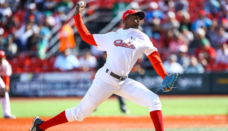 Raidel Martinez, closing pitcher for Cuba's Alazanes de Granma, launches a pitch in a Caribbean Series baseball game against Venezuela's Caribes de Anzoategui, in Guadalajara, Mexico, Friday, Feb. 2, 2018. The Caribbean Series baseball championship, featuring teams from Mexico, Puerto Rico, Dominican Republic, Cuba, and Venezuela, opened Friday in Jalisco State and will run until Feb. 8.