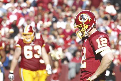 Jennifer Milbrett/The Washington Examiner
John Beck completed 30 of 47 passes for 254 yards, one touchdown and one interception, but a lot of his production came after the game had all but been decided Sunday.