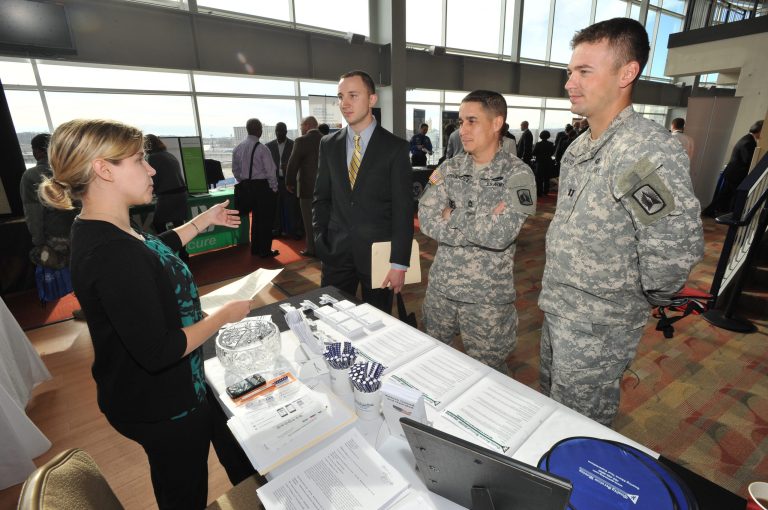 Job-seeking veterans and service members speak with a prospective employer at the Hiring Our Heroes DC job fair at Nationals Park on Wednesday, Dec. 5, 2012 in Washington. The House will debate and vote on a bill to increase job opportunities for veterans as well as legislation that would amend the Sarbanes-Oxley Act. (Larry French/AP Images for National Chamber Foundation)