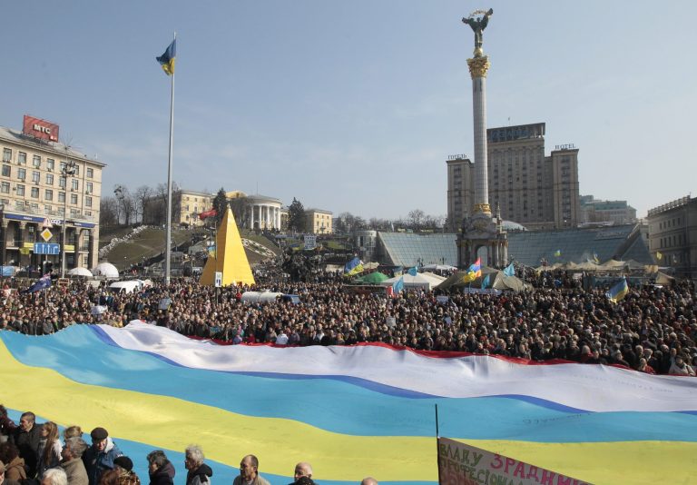 People display Ukrainian, Crimean and Crimean Tatar flags during a rally in support of Ukraine's territorial integrity in Kiev's Independence Square in Ukraine on March 23. (AP Photo/Sergei Chuzavkov, File)