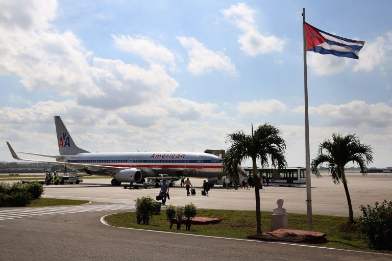 Passengers walk across the tarmac at Jose Marti International Airport after arriving on a charter plane operated by American Airlines January 19, 2015 in Havana, Cuba. (Getty images)