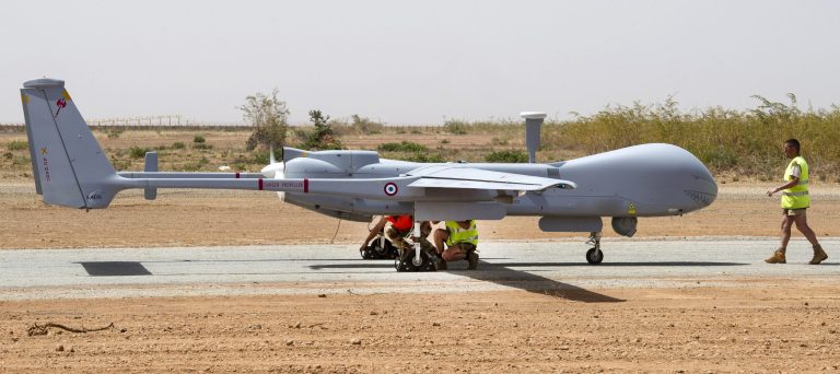 This photo taken Feb. 20, 2013 and released on March 6, 2013, by the French Army Communications Audiovisual office (ECPAD) shows French air force soldiers working on a Hartford drone returning from a mission over Mali, at the Niamey military base, in Niger. France said Monday for the first time that a key al-Qaida leader in Mali is probably dead. An activist close to the terror network's north Africa branch was also reported to have confirmed the death of Algerian-born warlord Abou Zeid.(AP Photo/Anthony Jeuland/ECPAD)