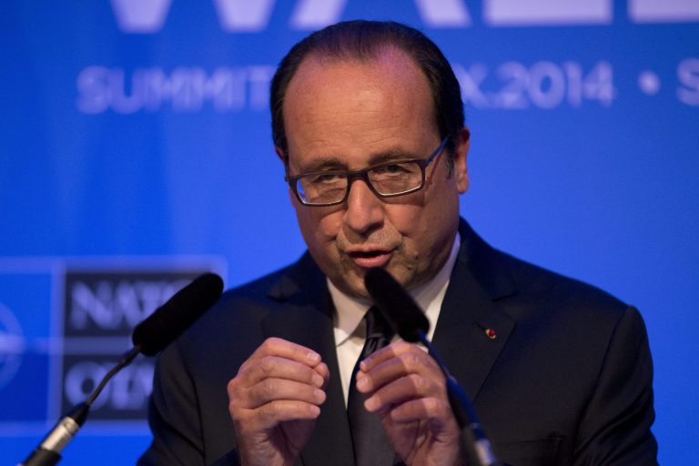 French President Francois Hollande gestures as he speaks during a press conference at the end of the NATO summit at the Celtic Manor Resort in Newport, Wales, Friday, Sept. 5, 2014.   (AP Photo/Matt Dunham)