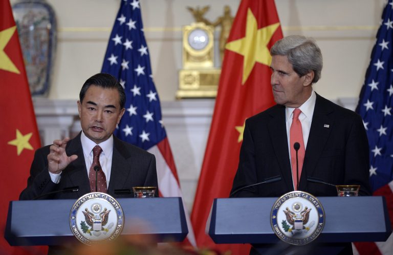   Secretary of State John Kerry, right, listens as Chinese Foreign Minster Wang Yi, left, speaks before their bilateral meeting at the State Department in Washington, Thursday, Sept. 19, 2013. Syria and North Korea as well as other issues were to be discussed. (AP Photo/Susan Walsh)  