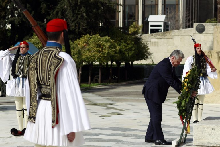 German President Joachim Gauck, places a wreath at the monument of the Unknown Soldier during his visit to Athens, on Thursday, March 6, 2014. Gauck is on a visit that will seek to lay to rest some of the ghosts of a brutal WWII Nazi occupation, amid renewed anti-German sentiment stoked by Greece's financial crisis. His three-day visit will include a speech Friday at a site where German army troops massacred 92 villagers near the northeastern town of Ioannina, and a meeting with the town's Jewish community. (AP Photo/Kostas Tsironis)