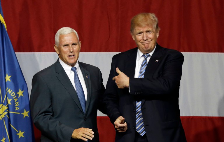 Indiana Gov. Mike Pence joins Republican presidential candidate Donald Trump at a rally in Westfield, Ind. (AP Photo/Michael Conroy)